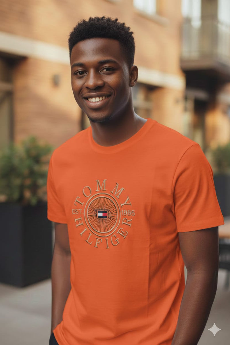Solara Tee — Men's Orange Circular Starburst Heritage Tee | GloblNorth
